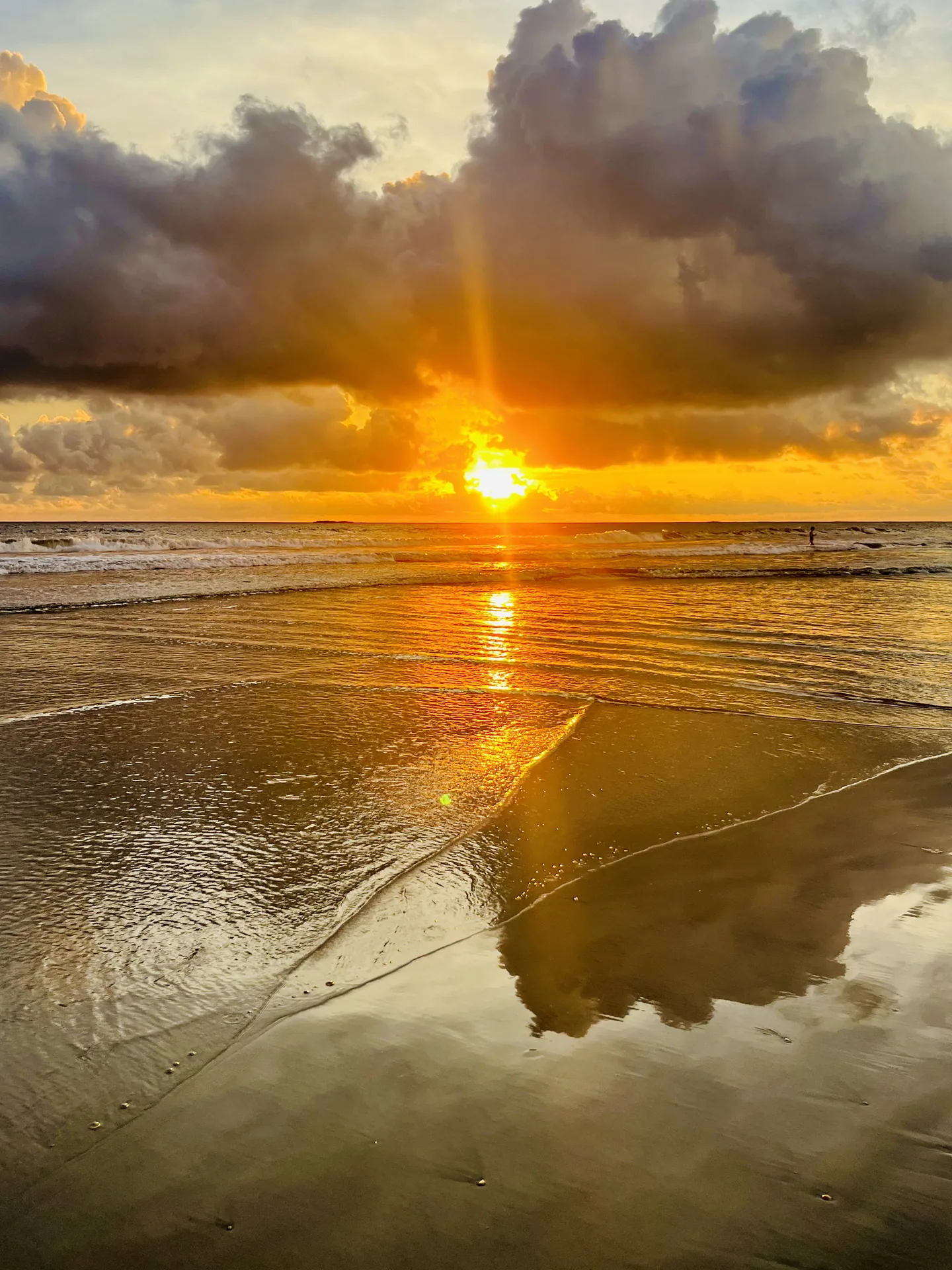Golden sunburst over the surf