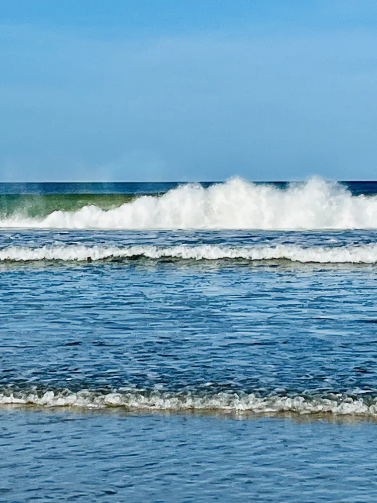 A clean wave breaking in the sun