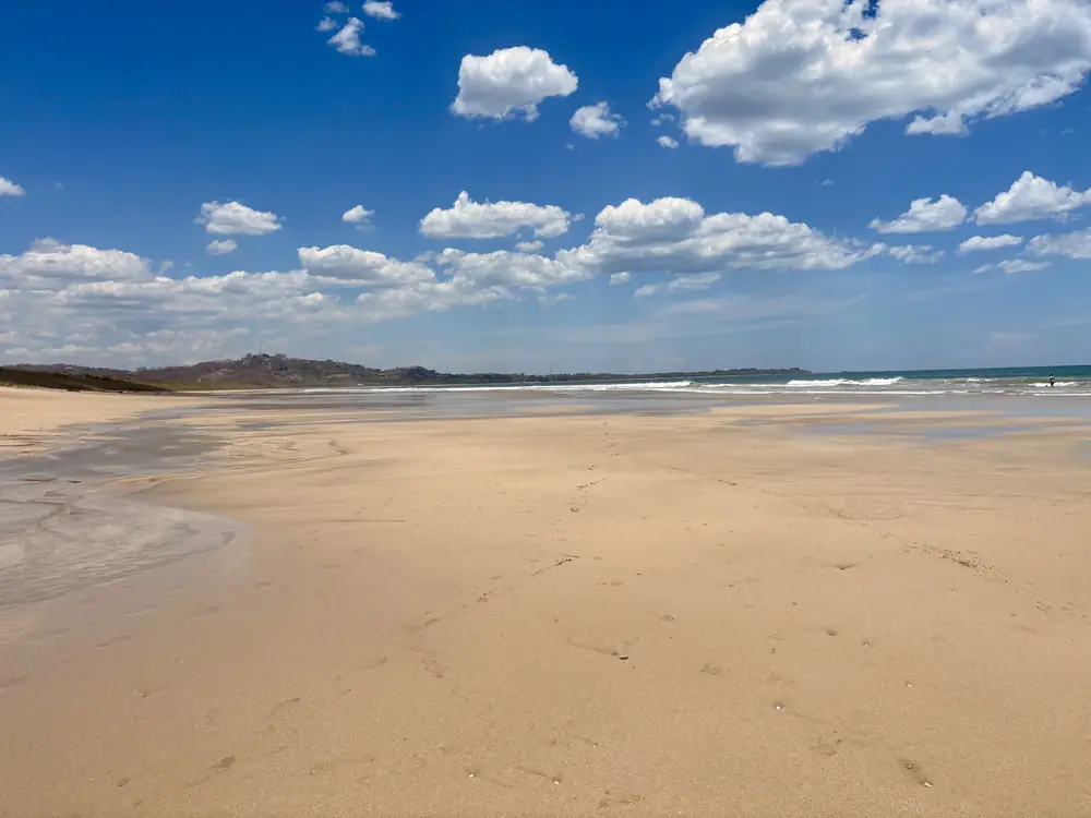 Wide open sand under a blue sky